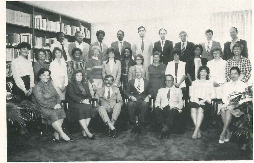 Front row: Margaret Riley, Ann Adcock, Edwin A. Willer, Edward G. Lee (Head of Post), Maurice H. Hébert, Margaret George, Paddy Walsh. Second Row: Claire Tirant, Theresa Bason, Pauline Morse, Lizzy Nkomo, Anne Wilson, Diane Greyvenstein, Mimie Makgabo, Ruby Dupuis, Marie M. Hébert, Lily Rormose, Dijah Augustine, Muriel MacGillivray, Cea Wood. Third row: Moses Nnawe, Roger H. Wilson, Thomas Mashishi, Simon Maserumule, John D. Corning, D. Clark, Bruce Fraser, David Baker, Len Dupuis.