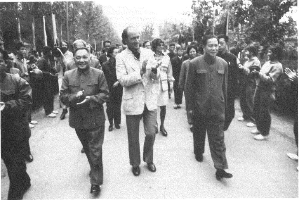 Prime Minister P.E. Trudeau walking on a street with officials, China 1973.