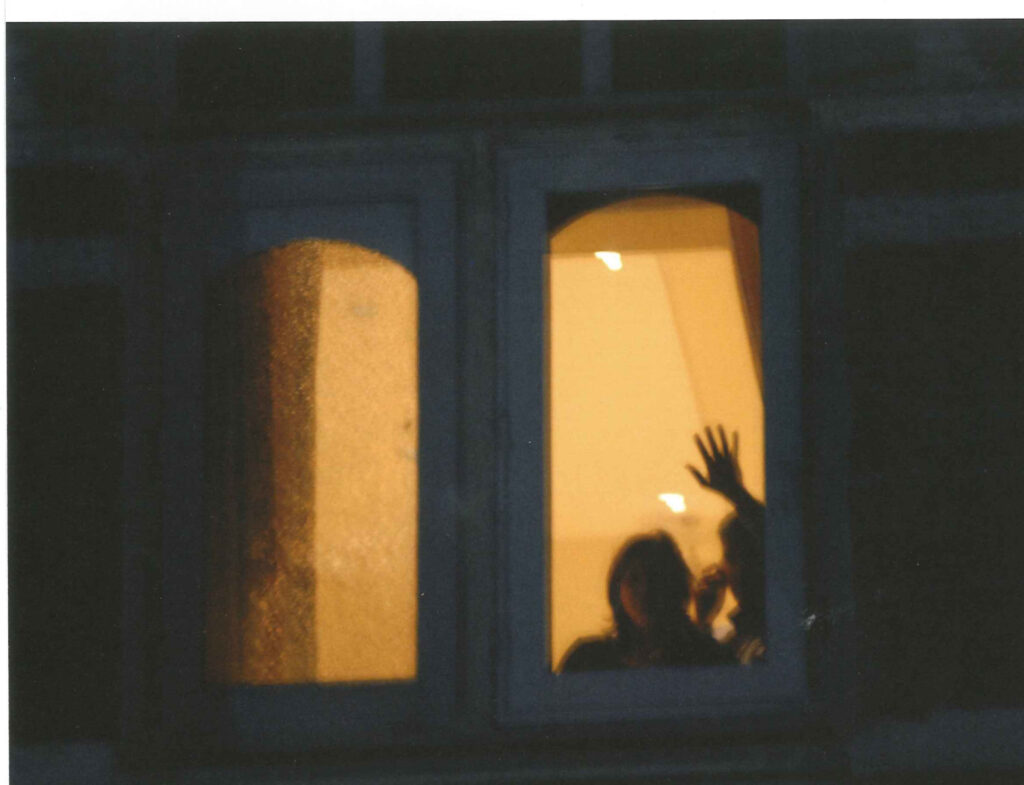 In the early hours of the siege, hotel guests signal to rescuers.