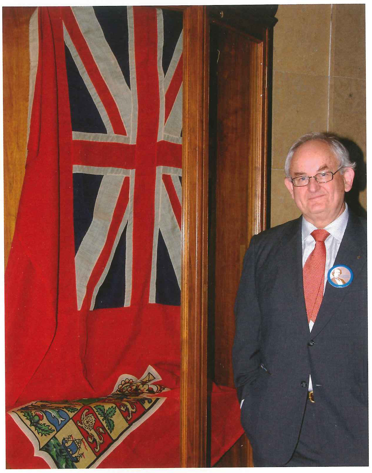 David Clendenning with his Red Ensign in a glass case at the Château Laurier.